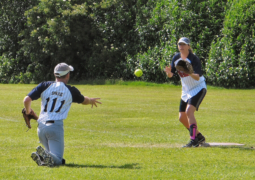 Jason Mercer flips to the ball to Lucy Morris at first base